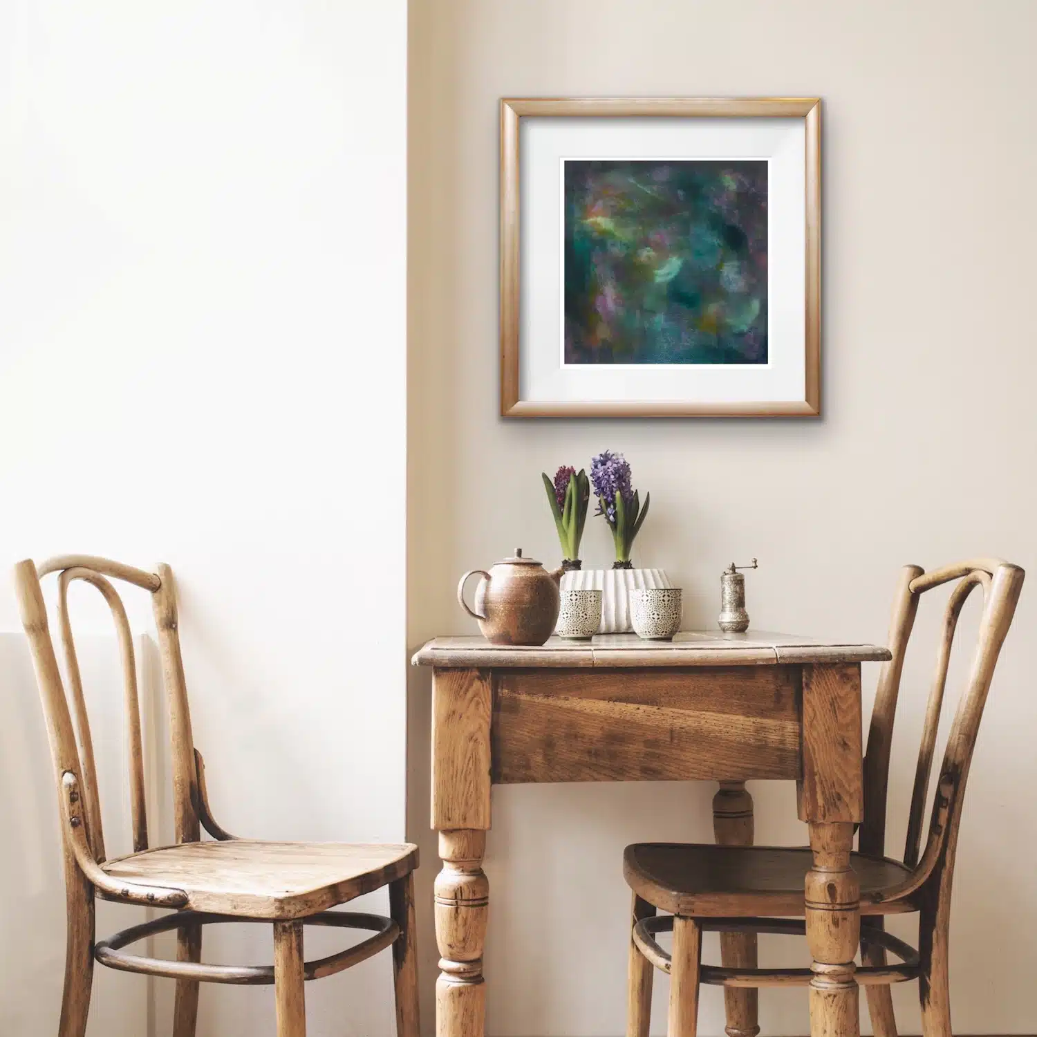 Metallic - Original oil painting hanging in a contemporary room Metallic - original abstract painting featuring metalic tones painted in oil on board displayed in a contemporary room with a wooden table and chairs.